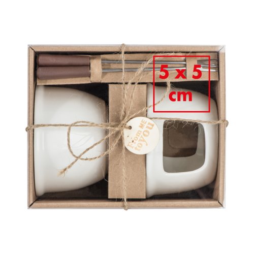 Witte keramische chocoladefondueset met vorken.